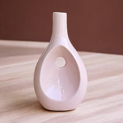 Pink Ceramic Vase with Unique Cutout Design